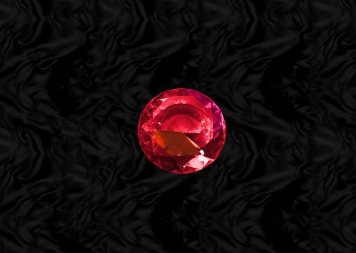 Glittering gem, red ruby on black velvet background