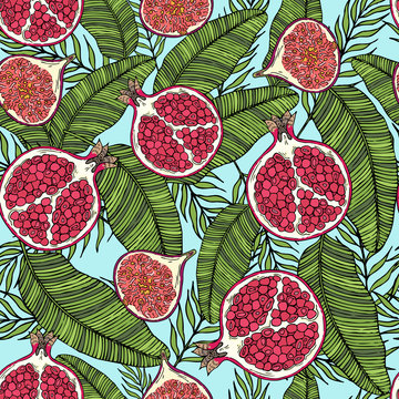 Pattern of fruits pomegranate and fig on the color of leaves. On a blue background.