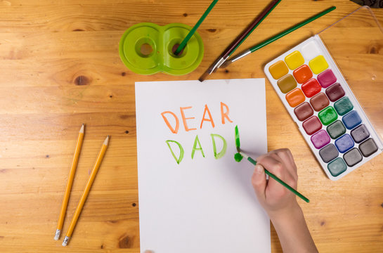 Kid draw greeting card for fathers day, empty space for text