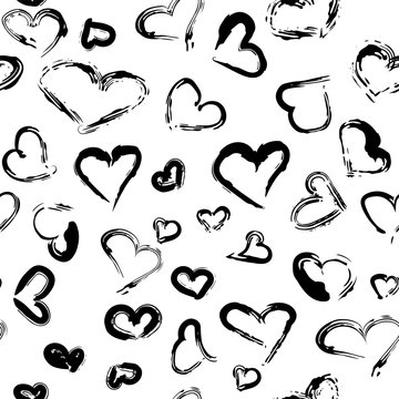 Seamless pattern with black hand drawn hearts in grunge style. Vector illustration