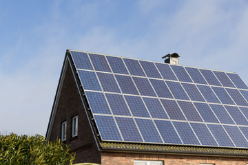 house with solar panels for photovoltaic on the roof 