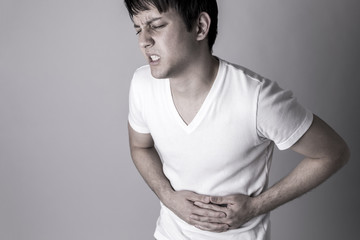 young man having a stomachache