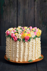 Fototapeta na wymiar Cake on a gray wooden background