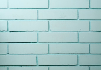 The brick wall painted in blue.