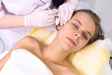 Mesotherapy injections in the face.
