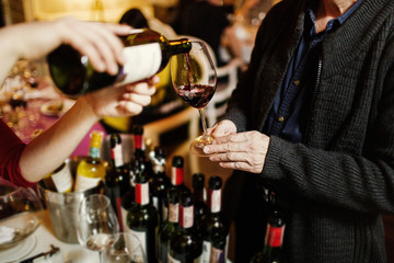 Red wine being poured into a wine glass