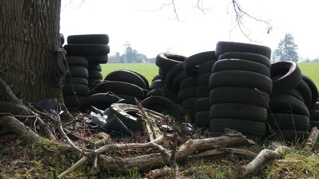 Pile of used tires in the countryside