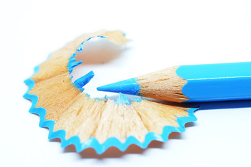 Sharpened blue color pencil and wood shavings