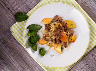 Liver with apple, spinach and onion. View from above, top studio shot