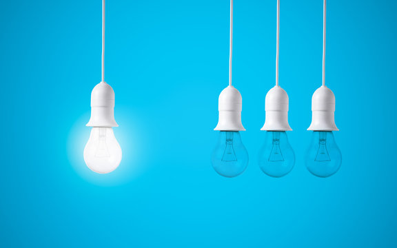 difference light bulb on blue background. concept of new ideas with innovation and creativity.