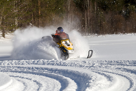 Athlete on a snowmobile