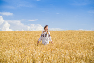 blonde on the field with wheat