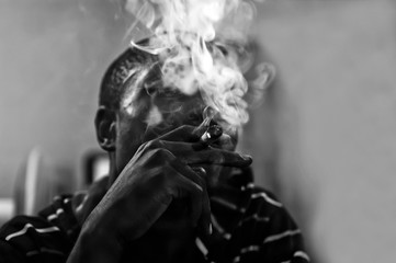 Close-up of African man smoking joint