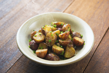 Oven roasted potatoes on wood table
