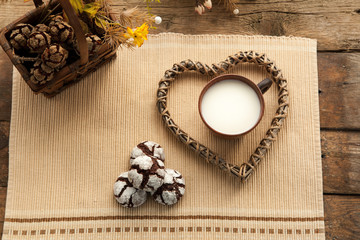 Homemade organic cookies with cocoa and chocolate, favorit grandmother's biscuit with cup of milk.