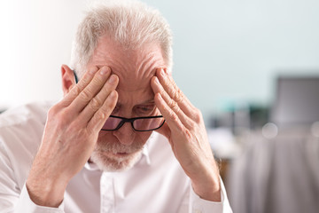 Tired senior businessman