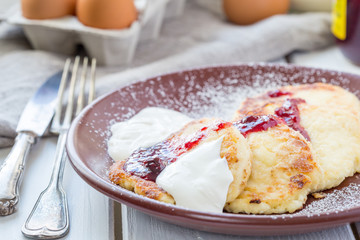 Cottage Cheese Pancakes with Strawberry Jam and Cream, Horizontal View