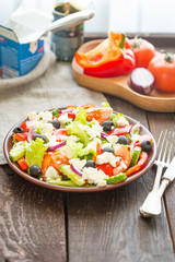 Fresh Vegetable Salad on Dark Wooden Background, Vertical View