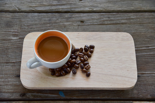A Cup coffee and beans on tray wood Japanese style