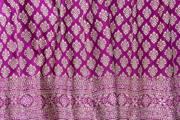 Vertical striped crumpled Thai silk textile.