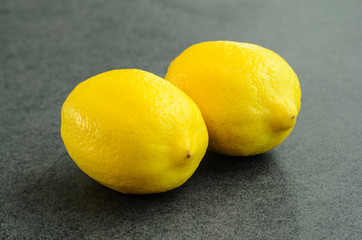 Closeup fresh two whole lemon