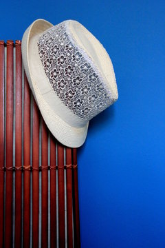 White summer hat on a wooden object