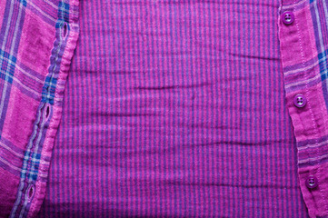 Textile texture of the checkered shirt, closeup the fastener useful as background