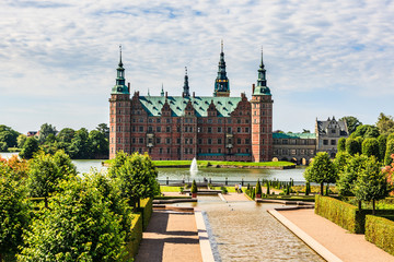 The majestic castle Frederiksborg Castle seen from the beautiful park area