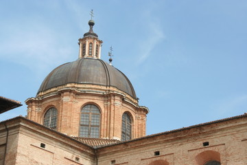 Fototapeta na wymiar Dome and roof of a reinassance palace in Urbino, central Italy