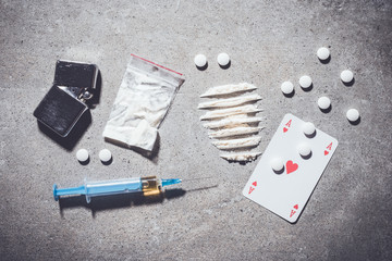 Overhead shot of hard drugs on gray stone background