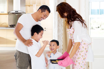 Fototapeta premium Asian kids eating home baked biscuit