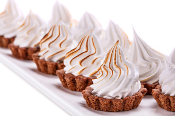 Dessert with fresh whipped cream on a plate.