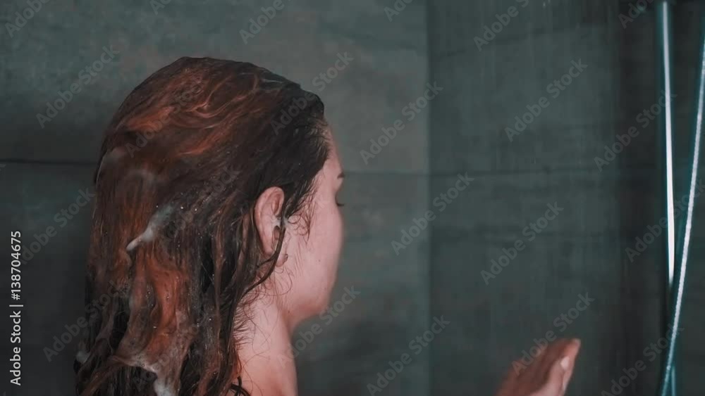 Poster Woman with long hair taking shower, slow motion