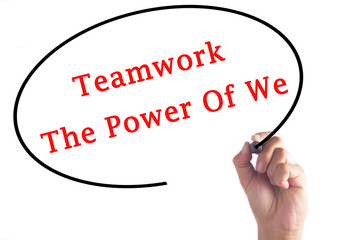 Hand writing Teamwork The Power Of We on transparent board