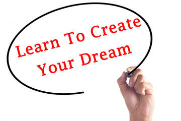 Hand writing Learn To Create Your Dream on transparent board