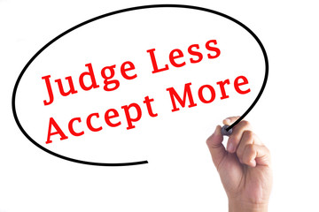 Hand writing Judge Less Accept More on transparent board