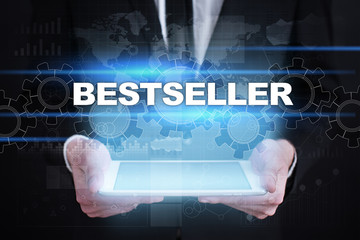 Businessman holding tablet PC with bestseller concept.