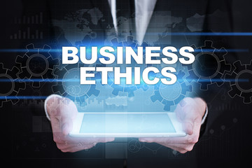 Businessman holding tablet PC with business ethics concept.
