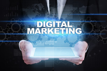 Businessman holding tablet PC with digital marketing concept.