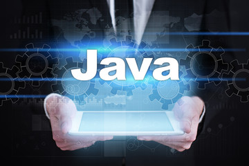 Businessman holding tablet PC with java  concept.