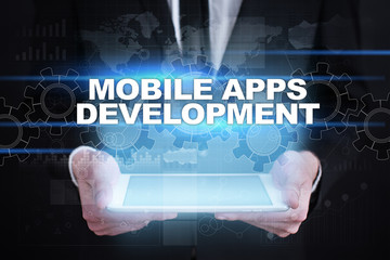 Fototapeta na wymiar Businessman holding tablet PC with mobile apps development concept.