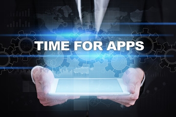 Businessman holding tablet PC with time for apps concept.