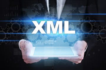 Businessman holding tablet PC with xml concept.