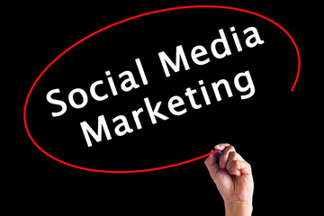 Hand Writing Social Media Marketing with a marker over transparent board