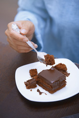Woman eating chocolate cake
