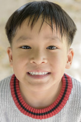 close up portrait of kid smiling to the camera