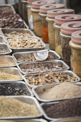Colorful spices powders and herbs in traditional street market in Delhi. India.