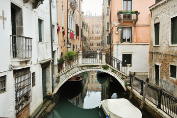 Fototapeta na wymiar Canal, bridge and buildings in Venice, Italy