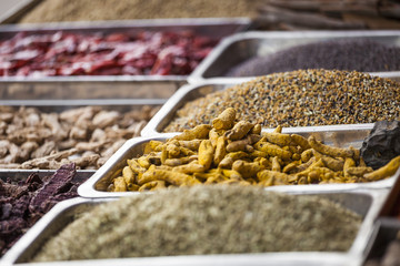 Colorful spices powders and herbs in traditional street market in Delhi. India.