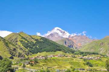Fototapeta na wymiar Panorama Kazbek and the surrounding mountain landscape